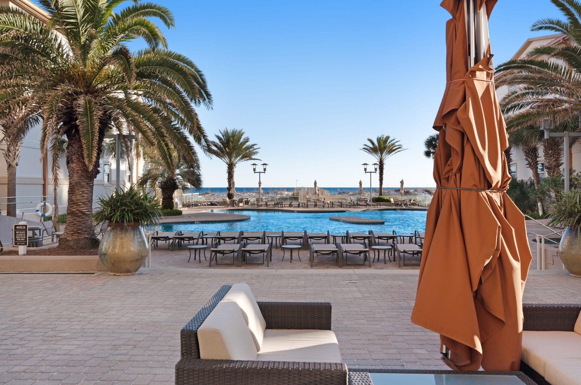 Take in beach and ocean views from the outdoor pool patio