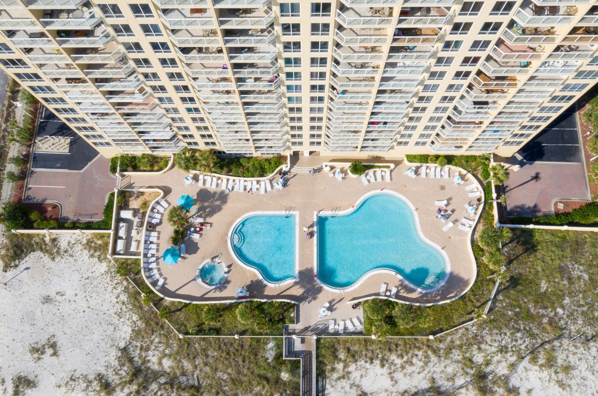 The luxury highrise features two outdoor pools