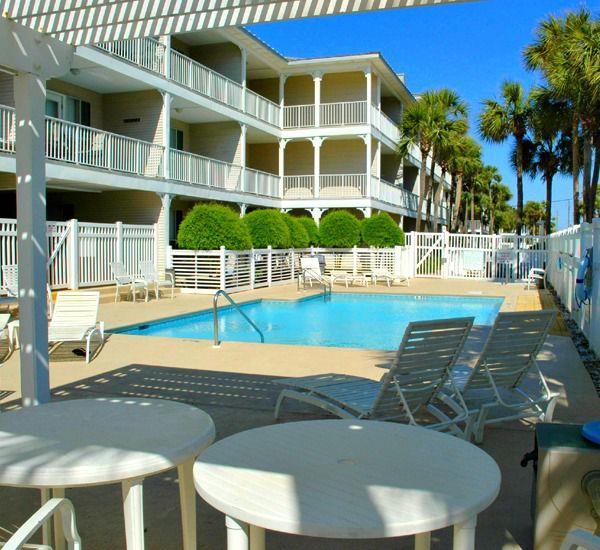 Relaxing pool area at Grand Caribbean Condo Rentals in Destin Florida