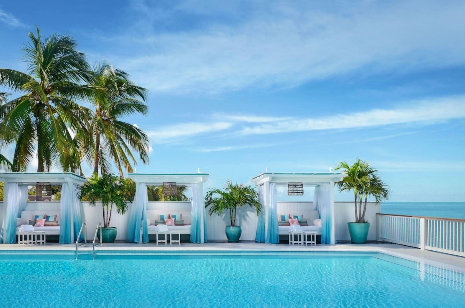 The swimming pool and lounge chairs at Ocean Key Resort