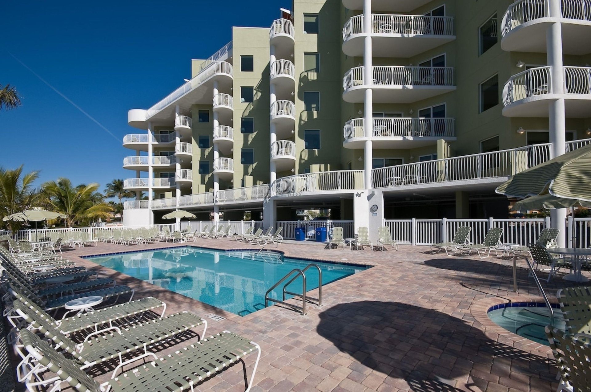 The outdoor pool and patio at Crystal Palms Beach Resort