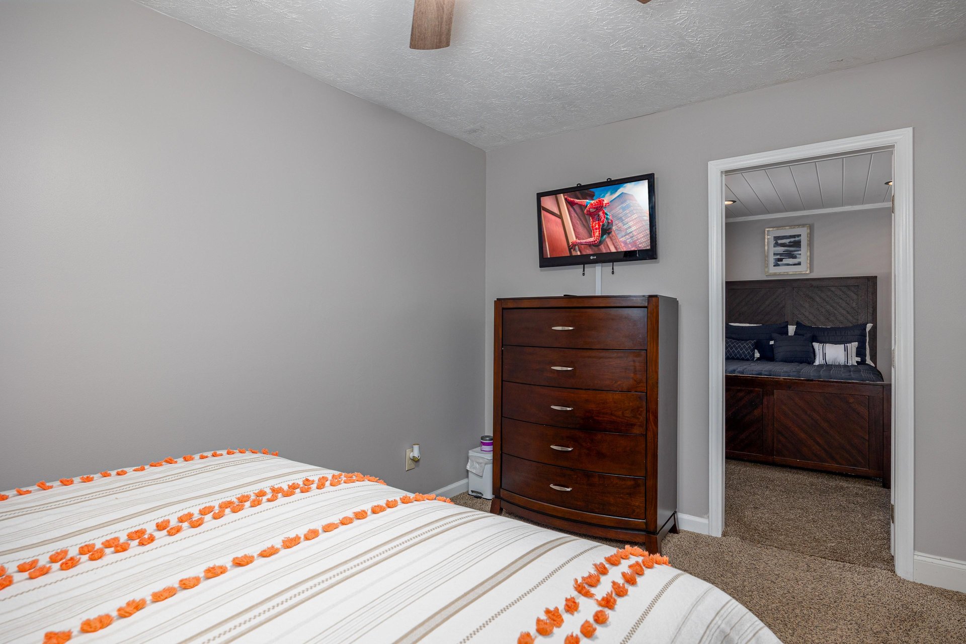 Bedroom dresser and flat screen tv at Hoop Dreams Lodge