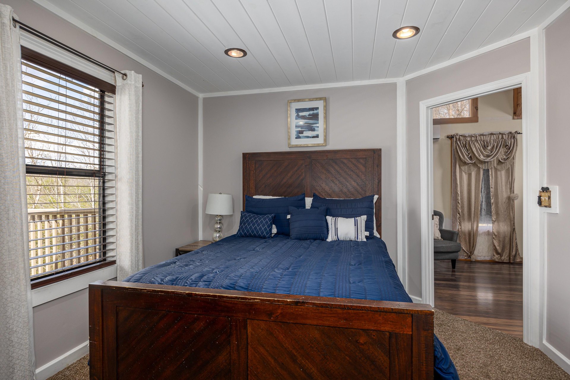 Bedroom with Nightstand at Hoop Dreams Lodge