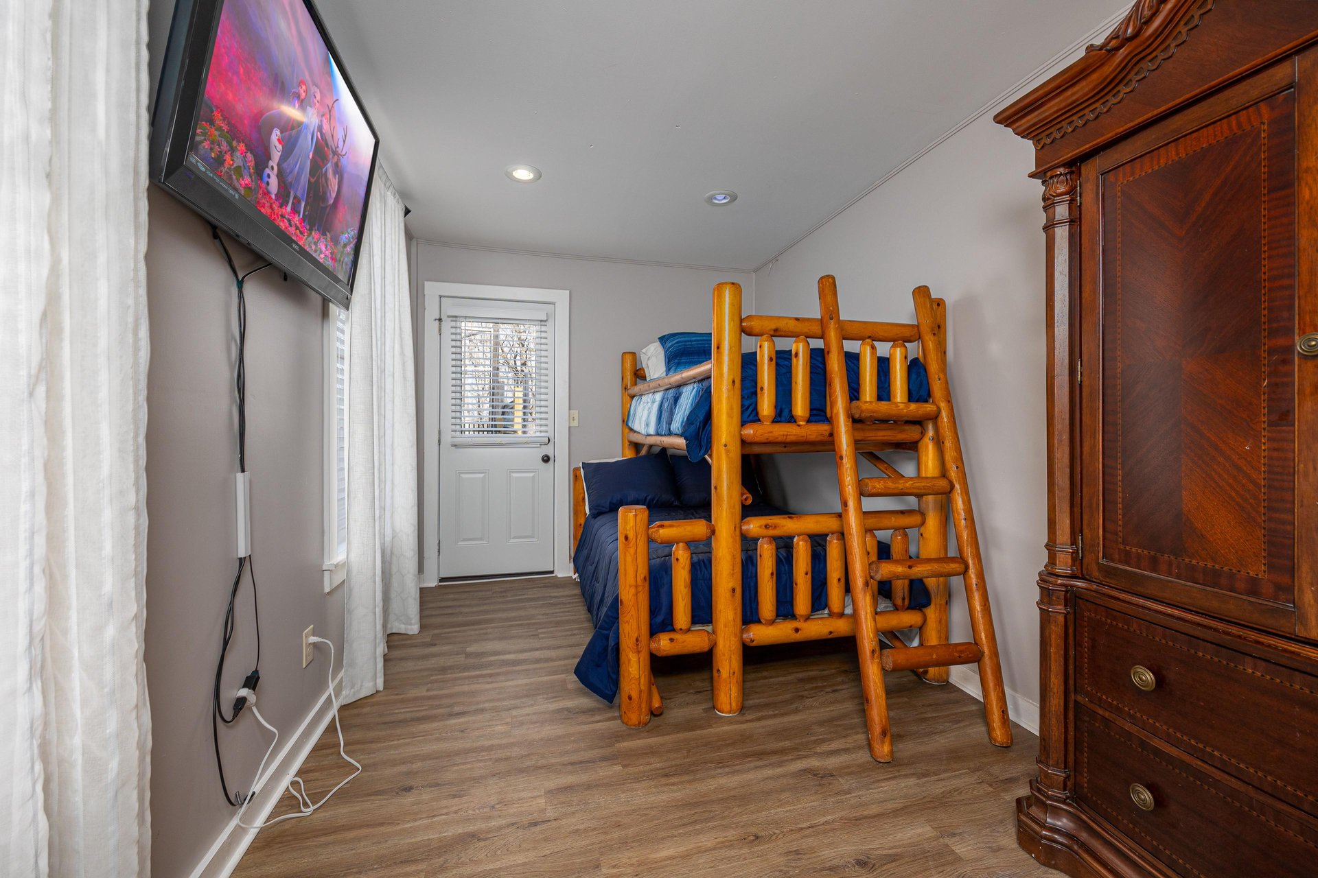 Bunk beds with Flat Screen Tv at Hoop Dreams Lodge