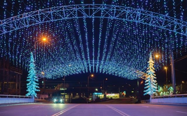 winterfest in pigeon forge road covered in handing christmas lights