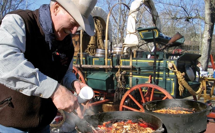 chuck wagon cookoff in pigeon forge cowboy cooking over cast iron