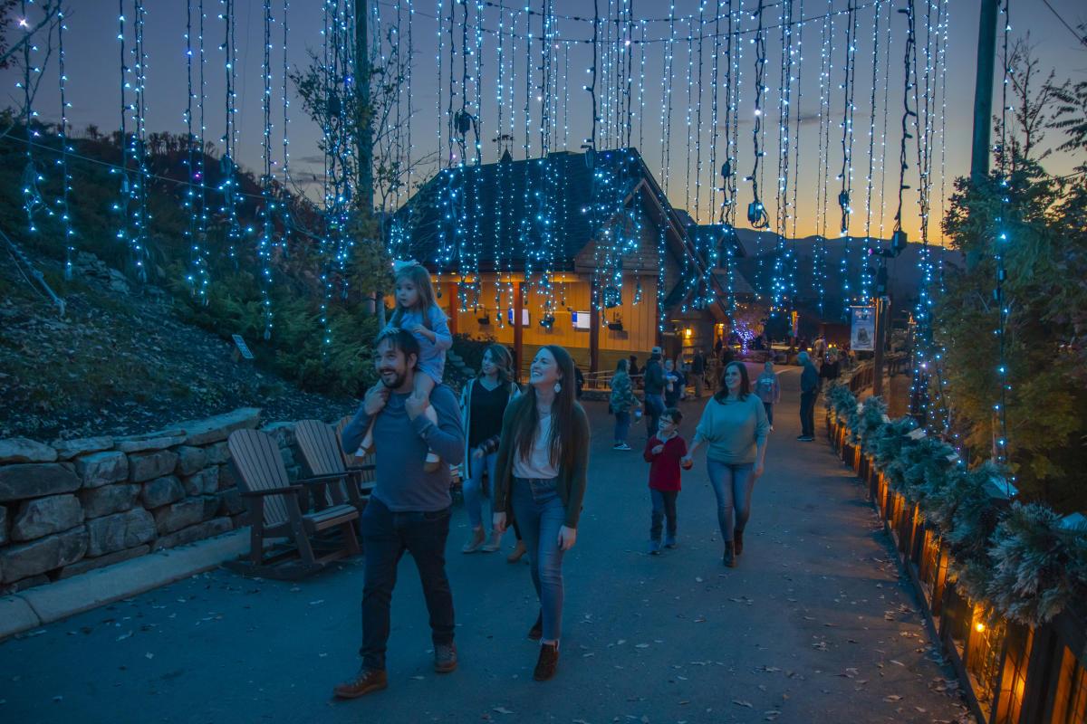 family walking under christmas lights at anakeesta in gatlinburg