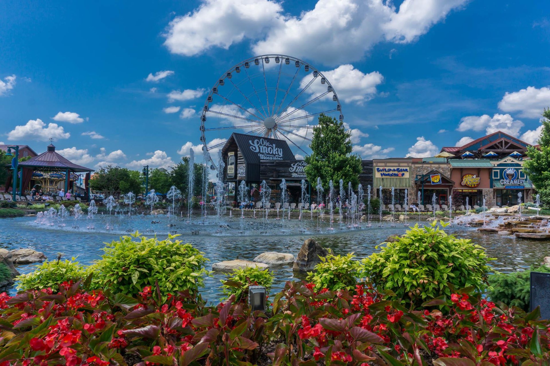 fountain with shops in the background at the island in pigeon forge