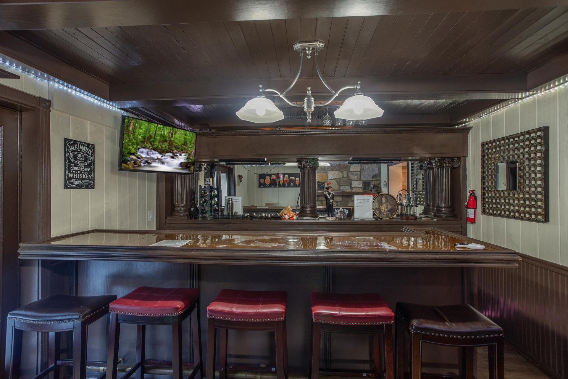 Wet bar with a TV on the lower floor at Best View Ever A 5 bedroom cabin rental in Pigeon Forge