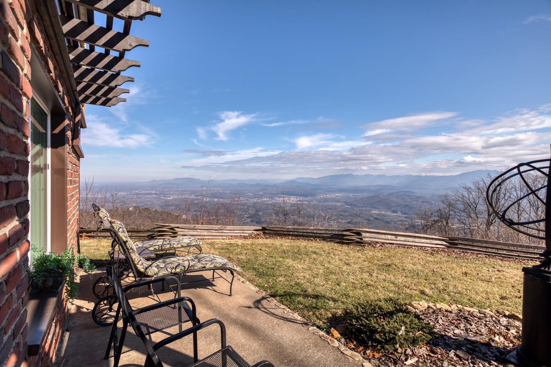 Lounge chairs on the back patio at Best View Ever A 5 bedroom cabin rental in Pigeon Forge