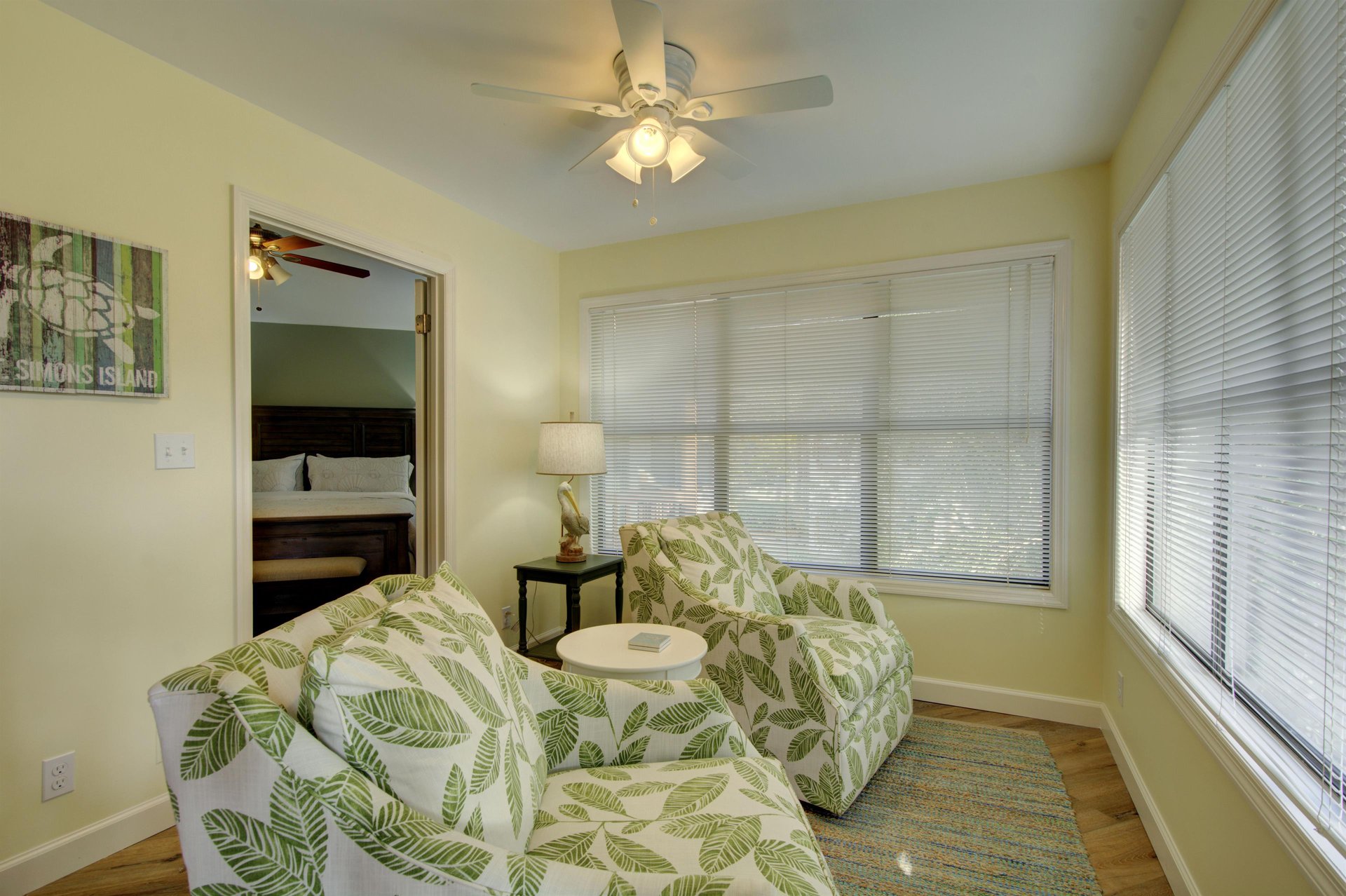 Catch the morning light or settle in with a book in this cheerful sitting nook at 406 Harbour Oaks, just outside the primary bedroom.