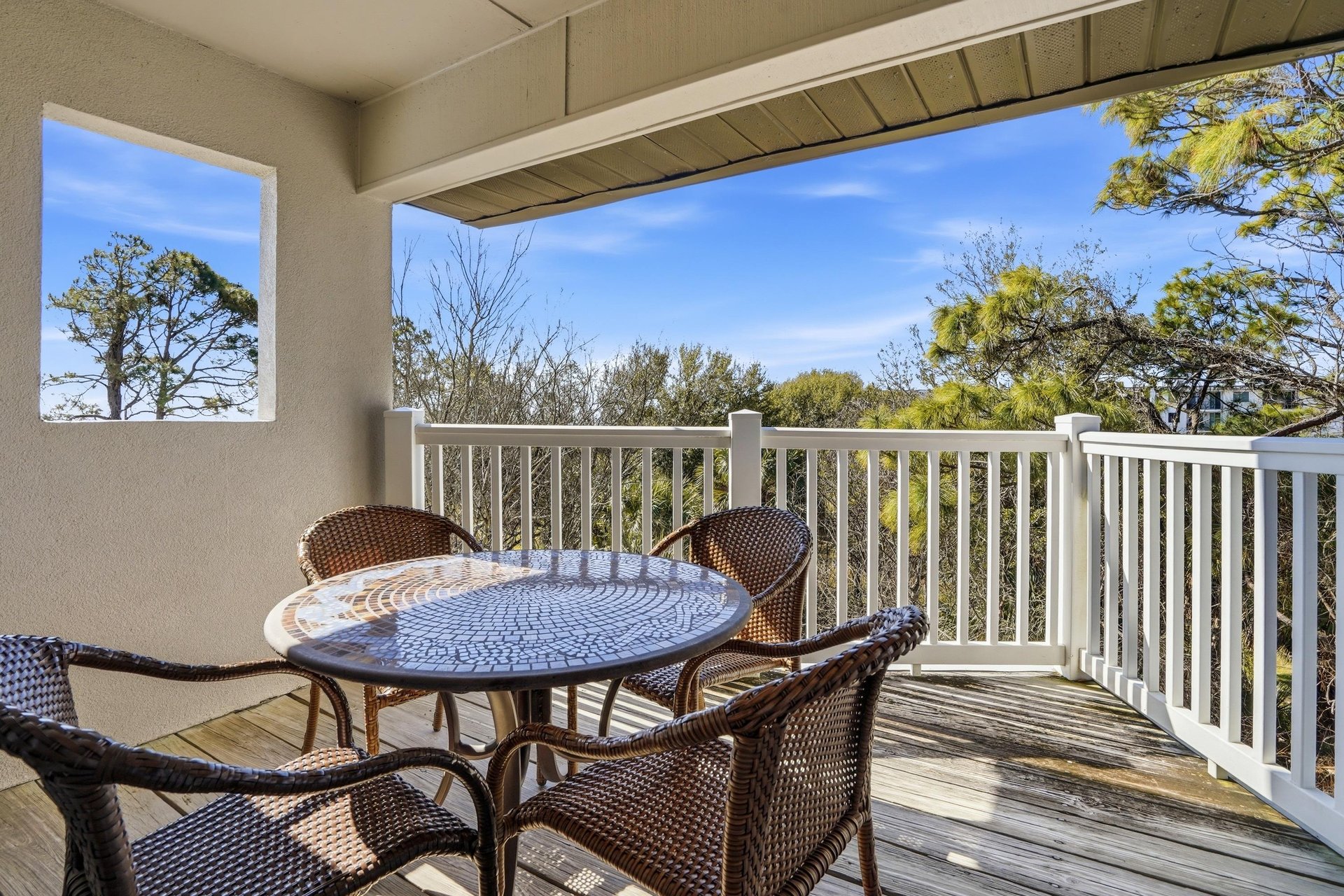 Located on the top floor, this balcony offers a peaceful spot to enjoy morning coffee with soft coastal light and treetop views.