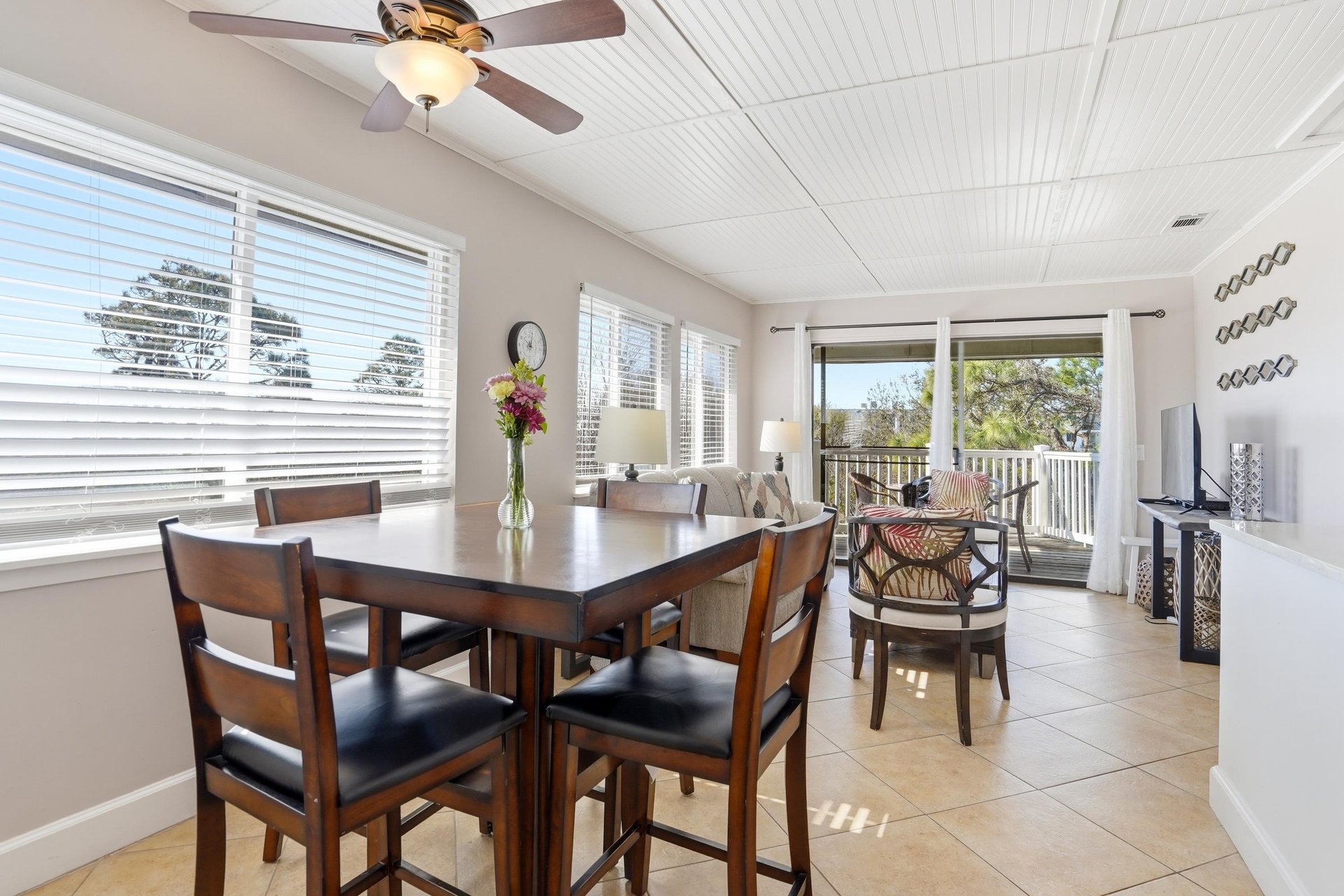 This dining area sits within the open living space, offering a comfortable spot for meals with easy access to the balcony.