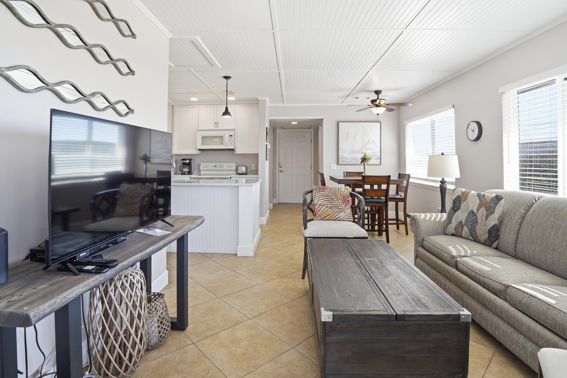 The open living area connects seamlessly to the kitchen and dining space, creating an easy flow for gathering, meals, and time together.