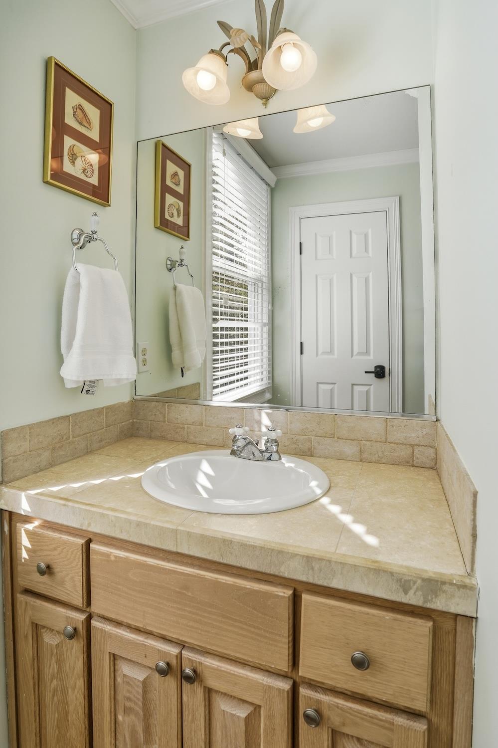 Ensuite bathroom connected to the upstairs kingandtwotwin bedroom, shown from the vanity area.