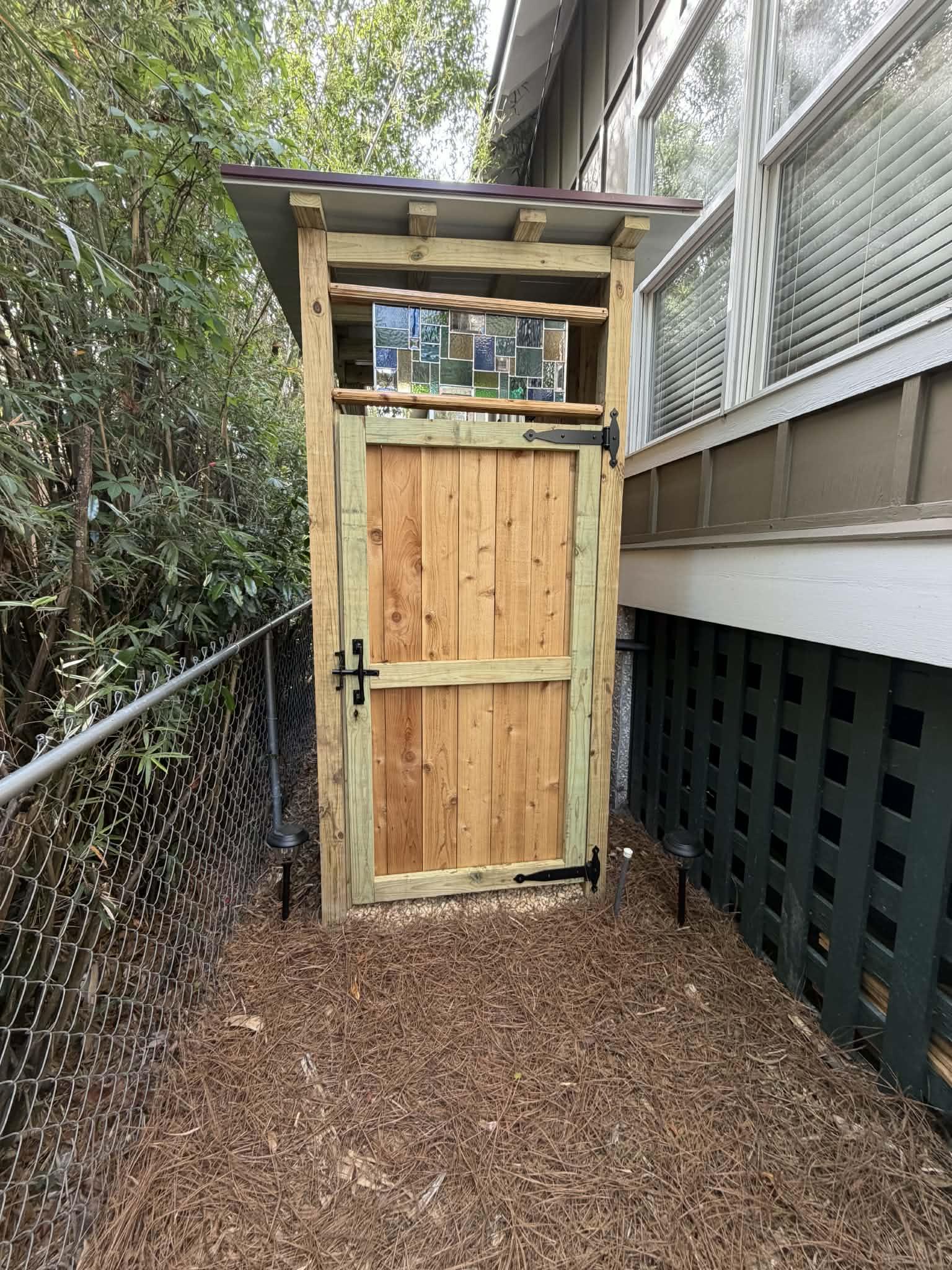 View of the private outdoor shower located on the side of the home at 1041 Ocean View.
