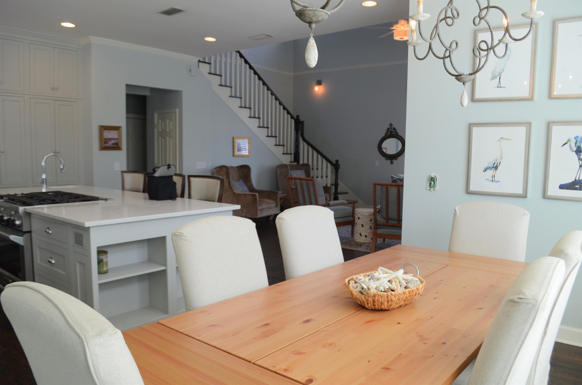 The table sits beside the kitchen for easy serving, takeout nights, and meals at home.