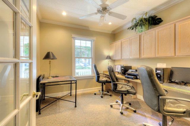 Business center with desks, computers, and printers for quick work needs.