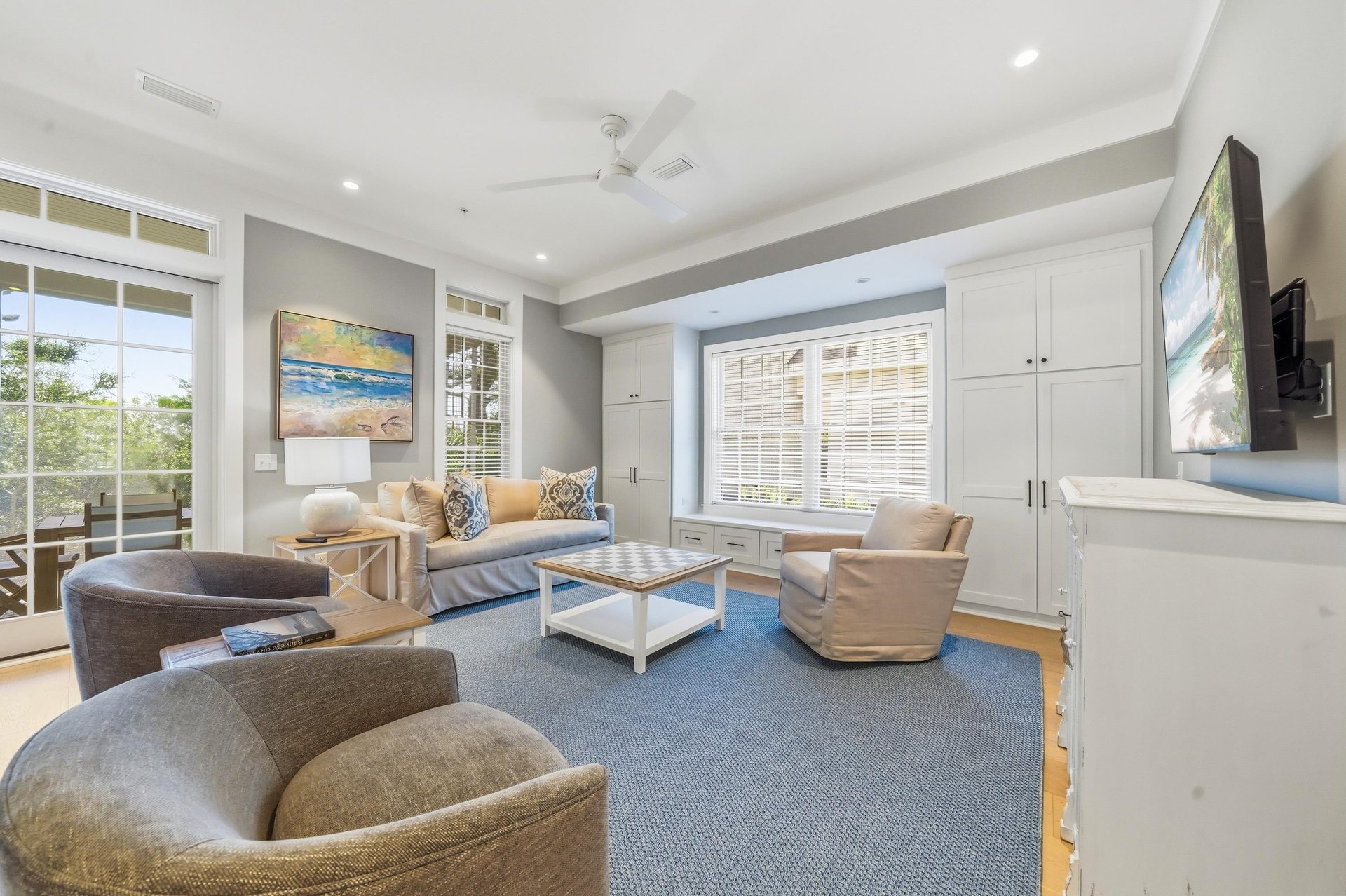 Comfortable seating, a large TV and builtins make this the everyday gathering spot after the beach.