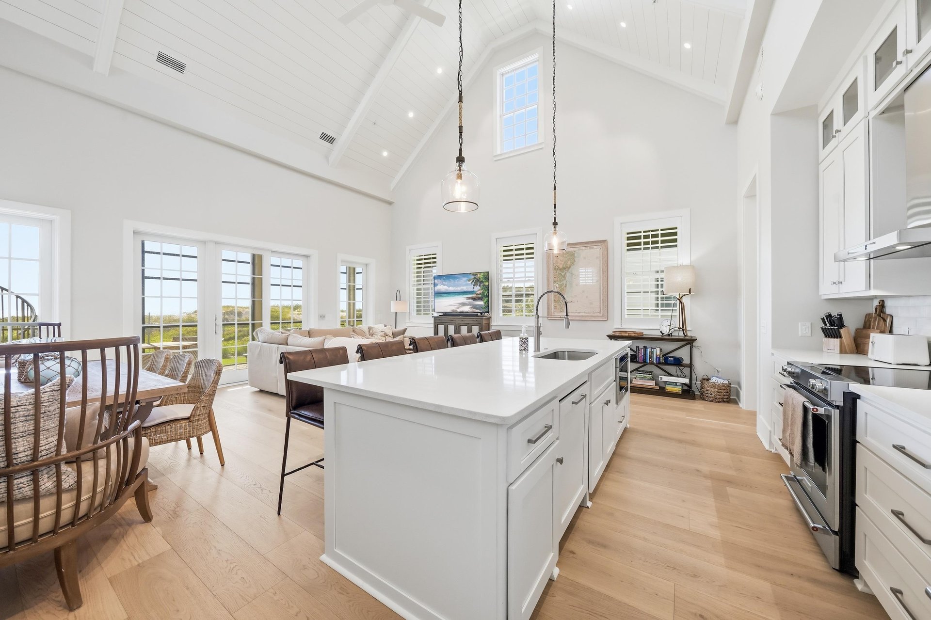 White beams span the kitchen, dining area and living room.