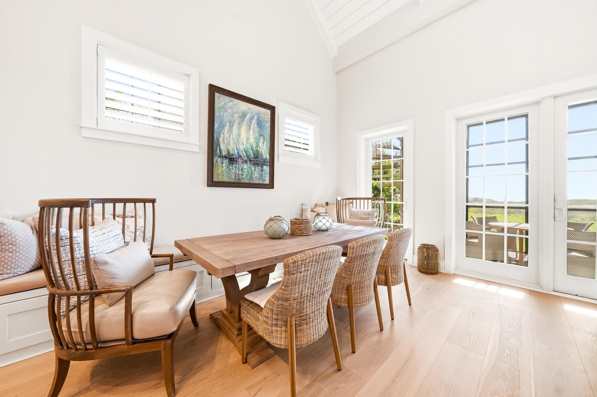Carry breakfast through the glass doors for a table overlooking the dunes.