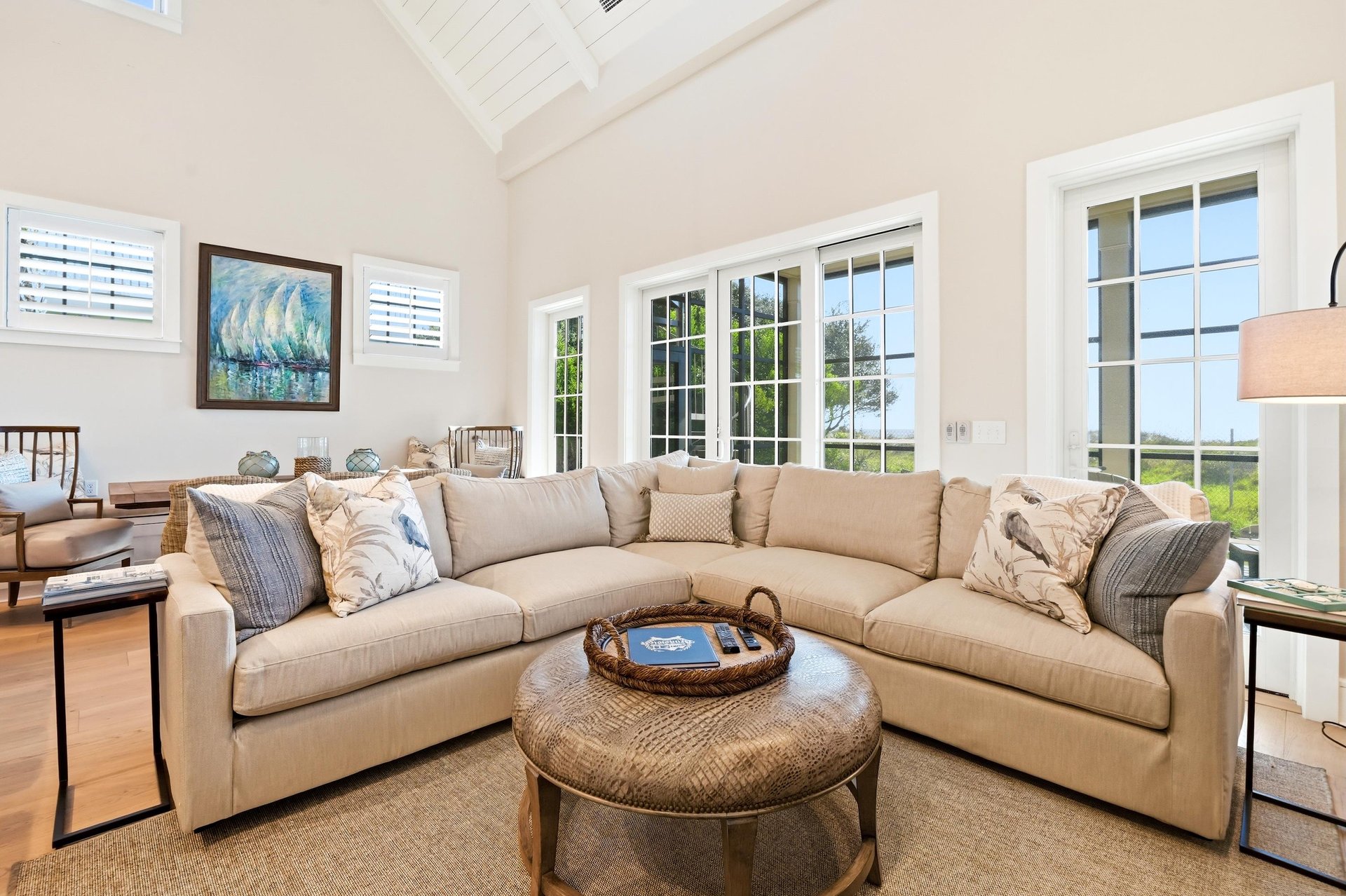 Tall glass doors bring light into the main gathering space.