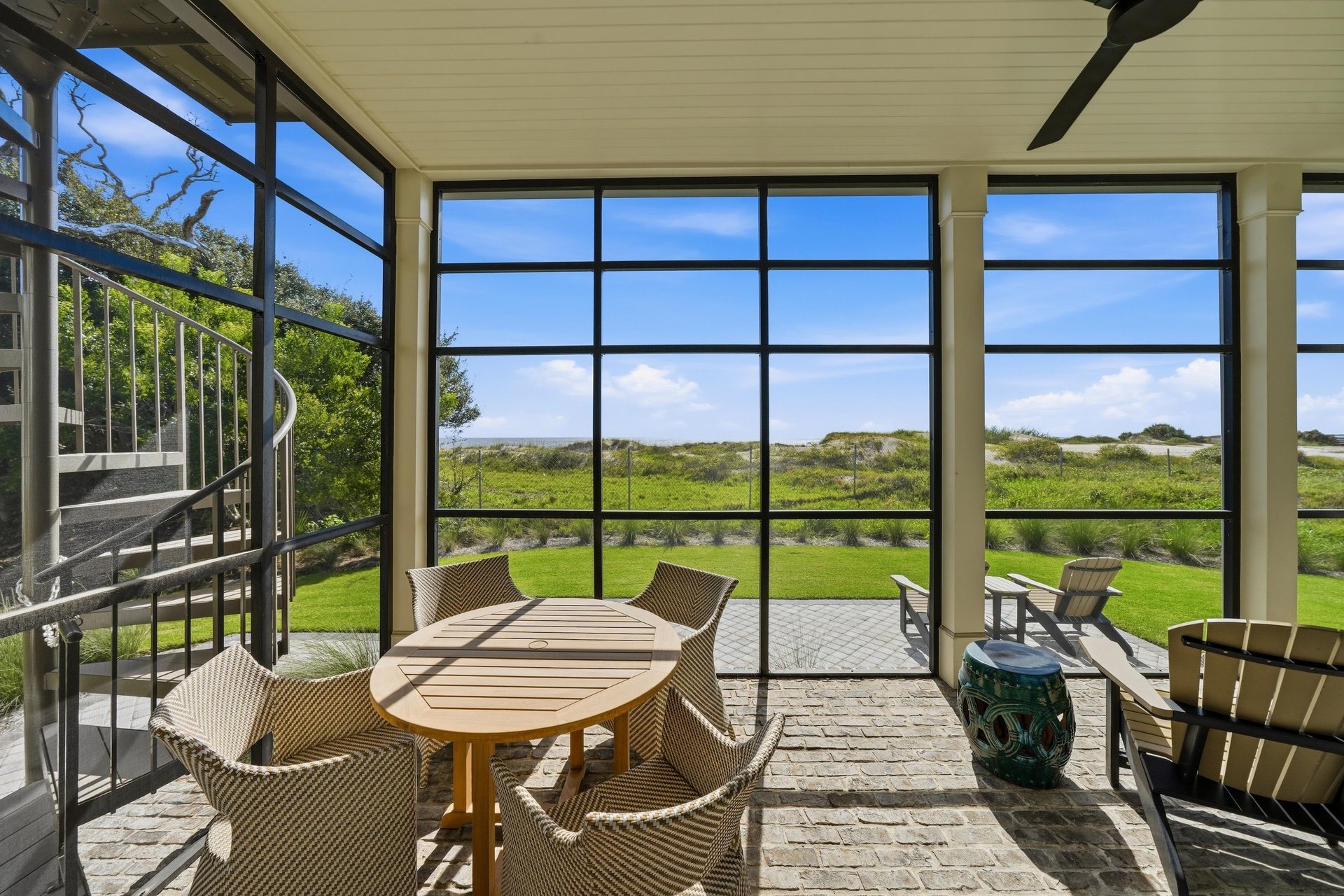 Choose the round dining table or Adirondack chairs overlooking the coast.