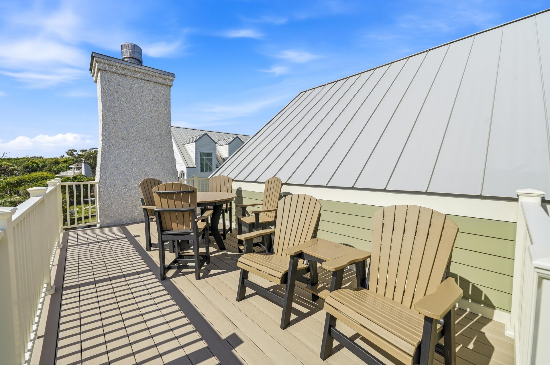 Chairs and a high table provide another place to spend time outside.