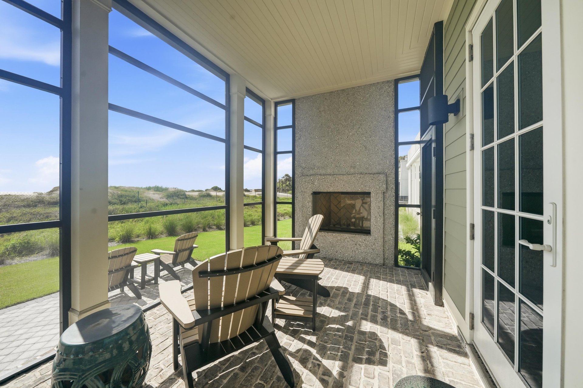 Adirondack chairs overlook the dunes. The fireplace is not for guest use.
