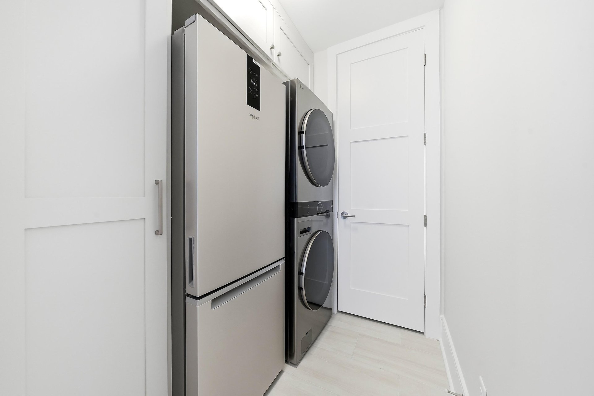 Keep extra drinks and groceries in the fullsize refrigerator beside the laundry.