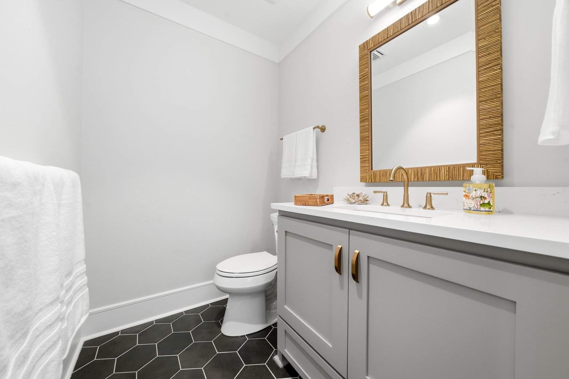 A separate half bath supplements the homes four full bathrooms.