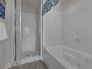 Primary bathroom with tub and walk in shower