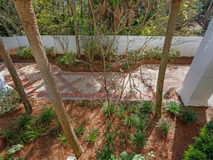 View of walk way to pool and beach