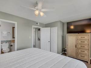 Primary Bedroom with Flat Screen TV and Attached Bathroom