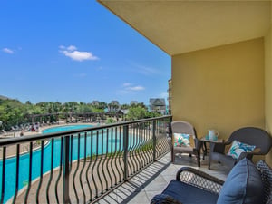 Private Balcony with Comfortable Seating and Pool View