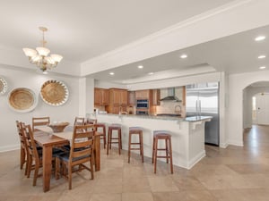 Open kitchen and dining with bar seating