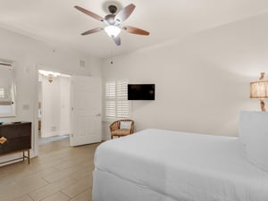 Guest Bedroom with Queen Bed and Mounted Flat Screen TV