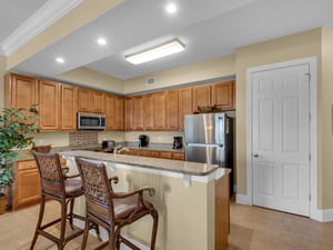 Breakfast bar seating and kitchen