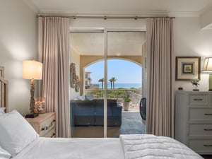 Primary bedroom with balcony access and Gulf view