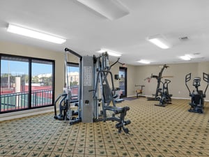 Fitness center overlooking tennis courts