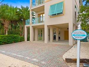 Private Driveway with Enough Room for 4 Cars  Rent a golf cart for your trips to the beach