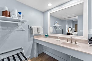 Bathroom vanity counter with large mirror