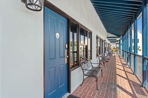 Ground floor open walkway to rooms