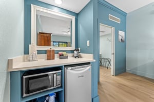 Kitchenette area with mini fridge, microwave and toaster