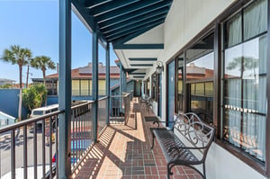 Second floor open walkway to rooms