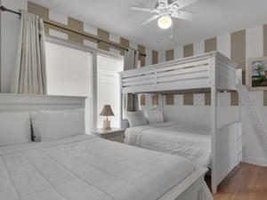 Guest Bedroom 1 with a Queen and Double Bunk Beds