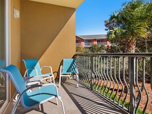 Private Balcony with Comfortable Seating and Pool View