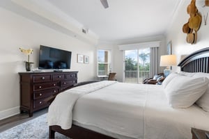 Primary bedroom with balcony access