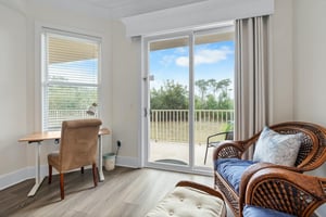 Primary bedroom with desk and chair