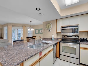 Kitchen overlooking living and Screened Porch